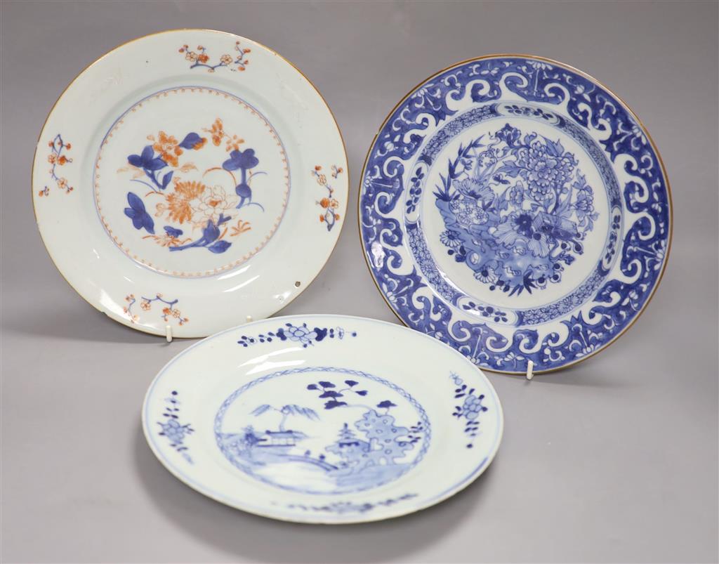 Three Chinese Qianlong plates, two blue and white, the third in Imari palette, diameter 23cm